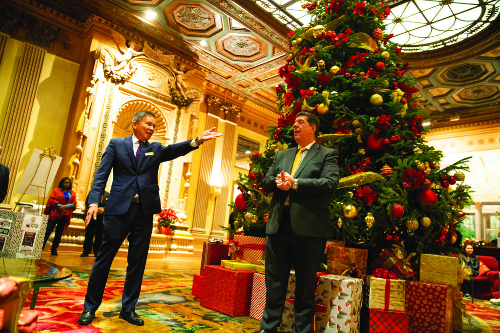 Jimmy Wu and Alex Decarvalho welcome guests to The Biltmore and the hotel’s Christmas tree. - Photo by Chris Mortenson