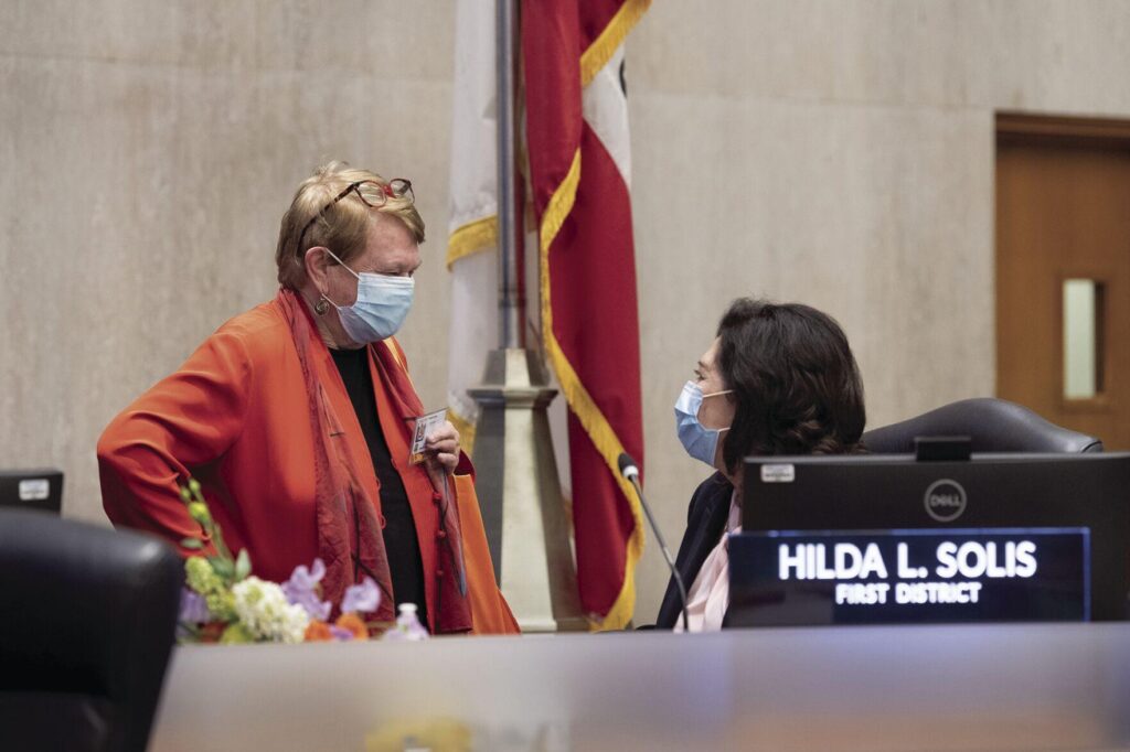Los Angeles County Supervisor Sheila Kuehl, left, confers Supervisor Hilda L Solis during the Board of Supervisors meeting on April 5, 2022. - Photo courtesy of Bryan Chan 